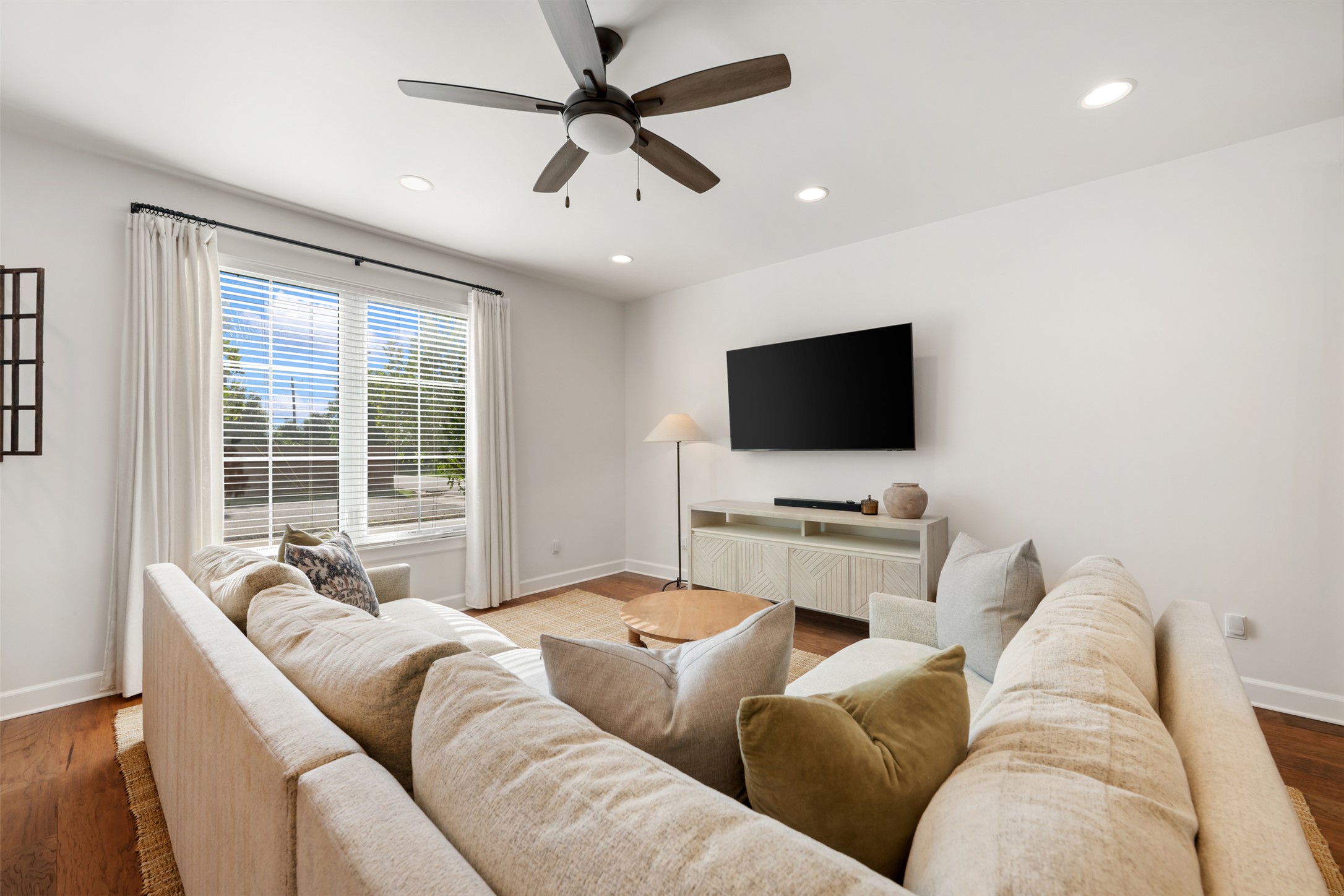 1301 West Street Georgetown, TX 78626 - Photo 6 of 40 Recessed lighting and a ceiling fan adorn this welcoming living space, perfect for everyday comfort.