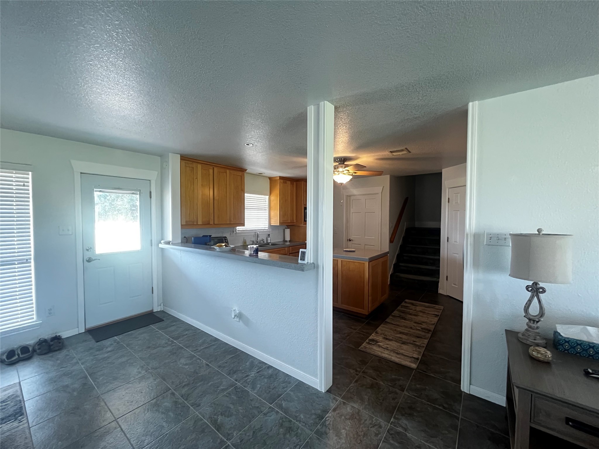 1100 Swiss Alp Hills Loop Schulenburg, TX 78956 - Photo 13 of 46 a view of a hallway with bathroom and wooden floor