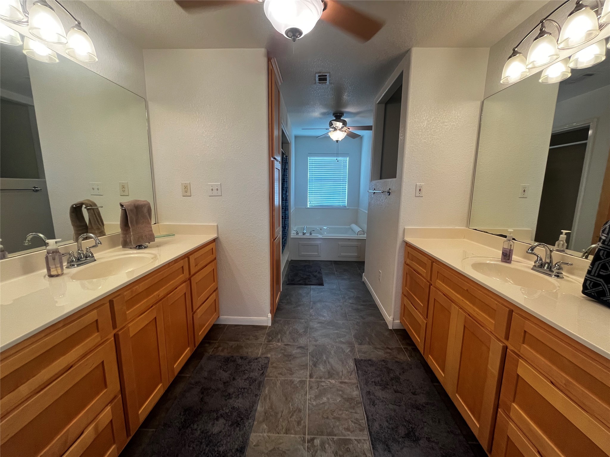1100 Swiss Alp Hills Loop Schulenburg, TX 78956 - Photo 20 of 46 Beautiful Primary Bath, Dual Vanities, Dual Ceiling Fans, Tile Floor