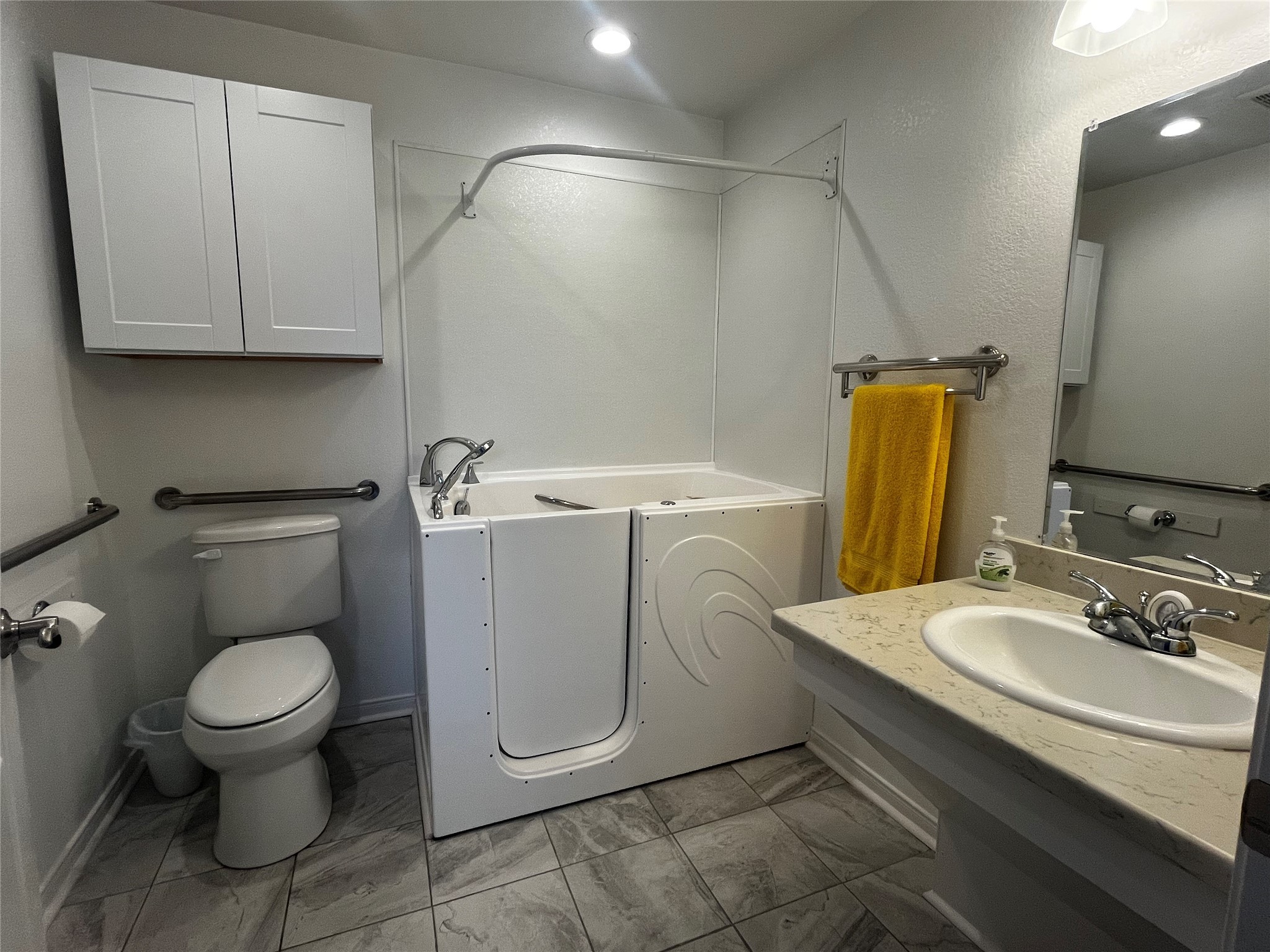 1100 Swiss Alp Hills Loop Schulenburg, TX 78956 - Photo 28 of 46 a bathroom with a toilet sink and mirror