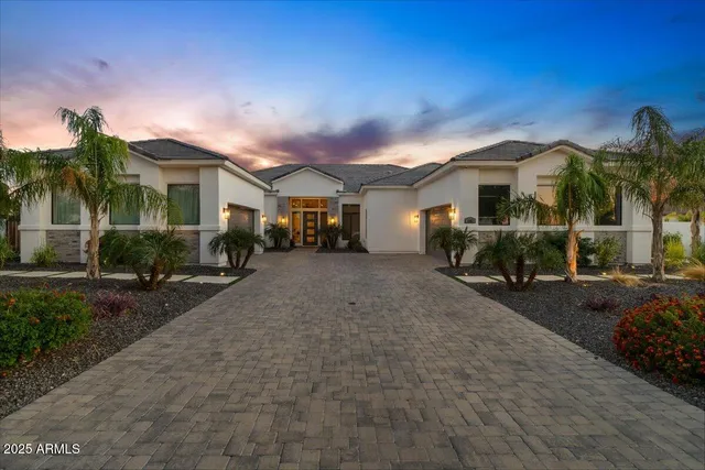 an aerial view of residential houses with city view