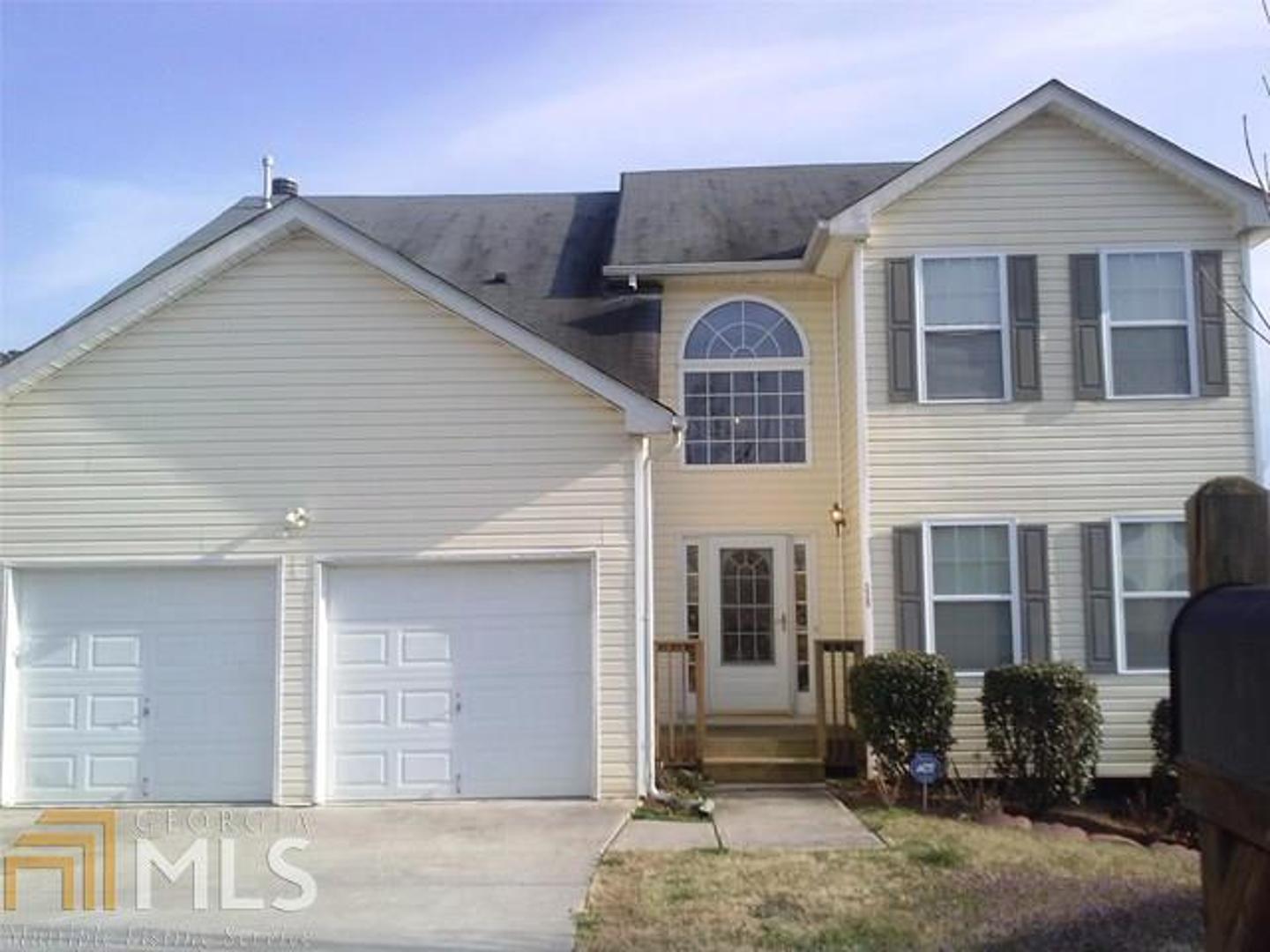 320 Blue Sail Lane Atlanta, GA 30349 - Photo 1 of 1 a view of a house with a yard and sitting area