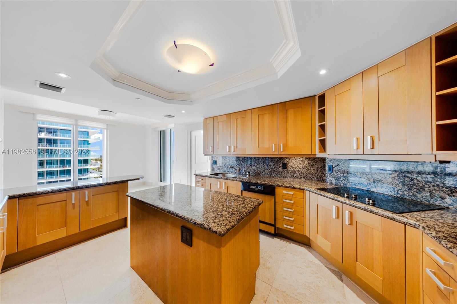 430 Grand Bay Drive, Unit 902 Key Biscayne, FL 33149 - Photo 18 of 87 a kitchen with stainless steel appliances granite countertop sink stove top oven and cabinets