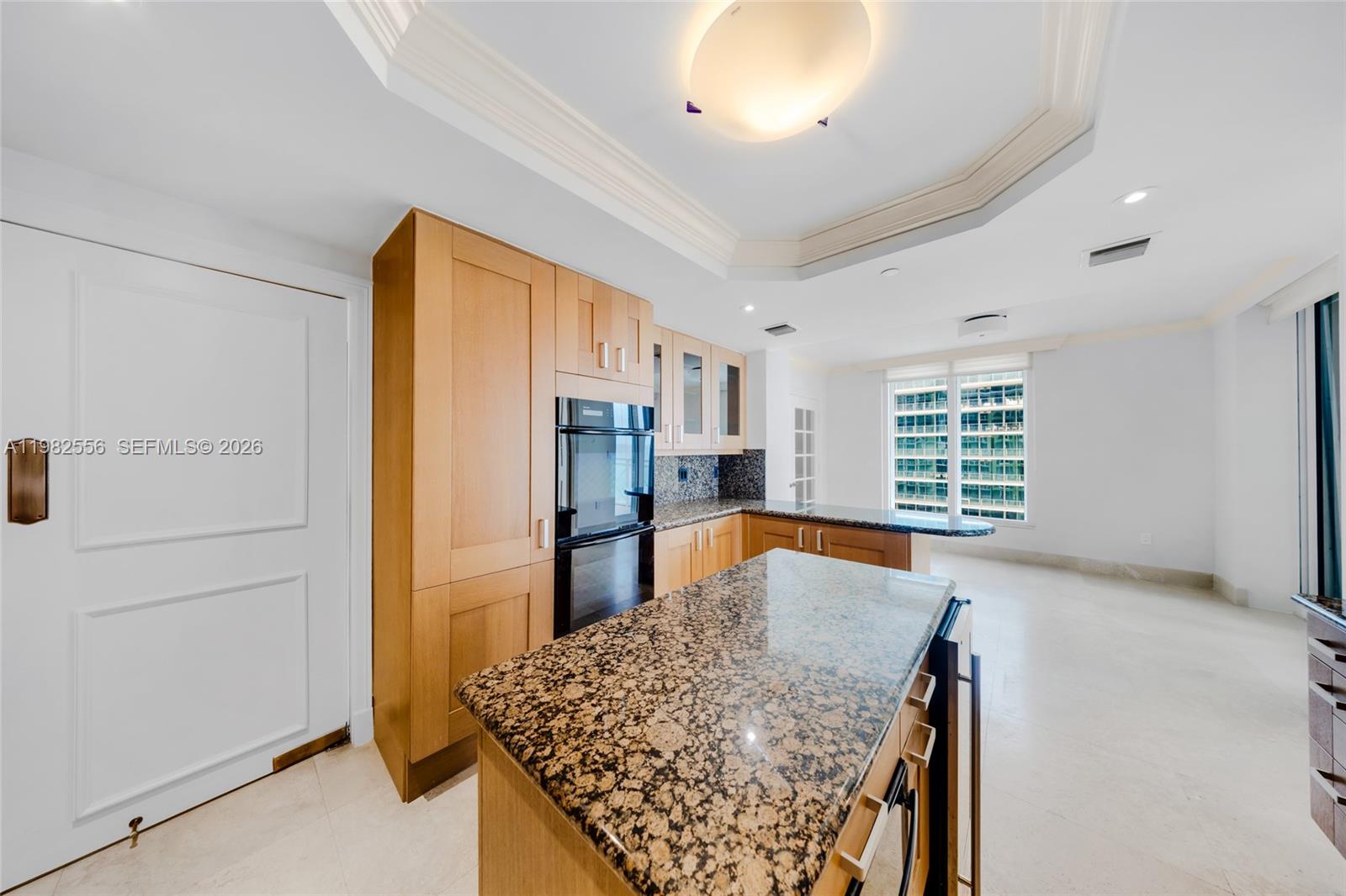 430 Grand Bay Drive, Unit 902 Key Biscayne, FL 33149 - Photo 19 of 87 a kitchen with stainless steel appliances granite countertop a refrigerator and a stove top oven