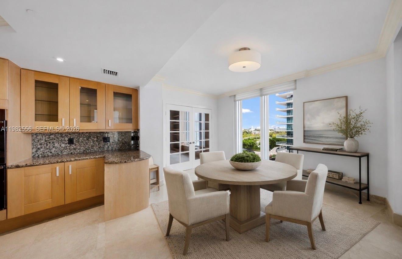 430 Grand Bay Drive, Unit 902 Key Biscayne, FL 33149 - Photo 22 of 87 a dining room with furniture and window