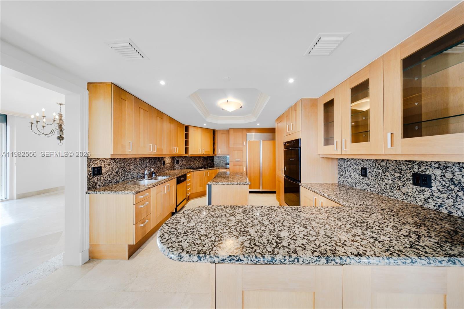 430 Grand Bay Drive, Unit 902 Key Biscayne, FL 33149 - Photo 25 of 87 a kitchen with stainless steel appliances granite countertop a sink stove and refrigerator