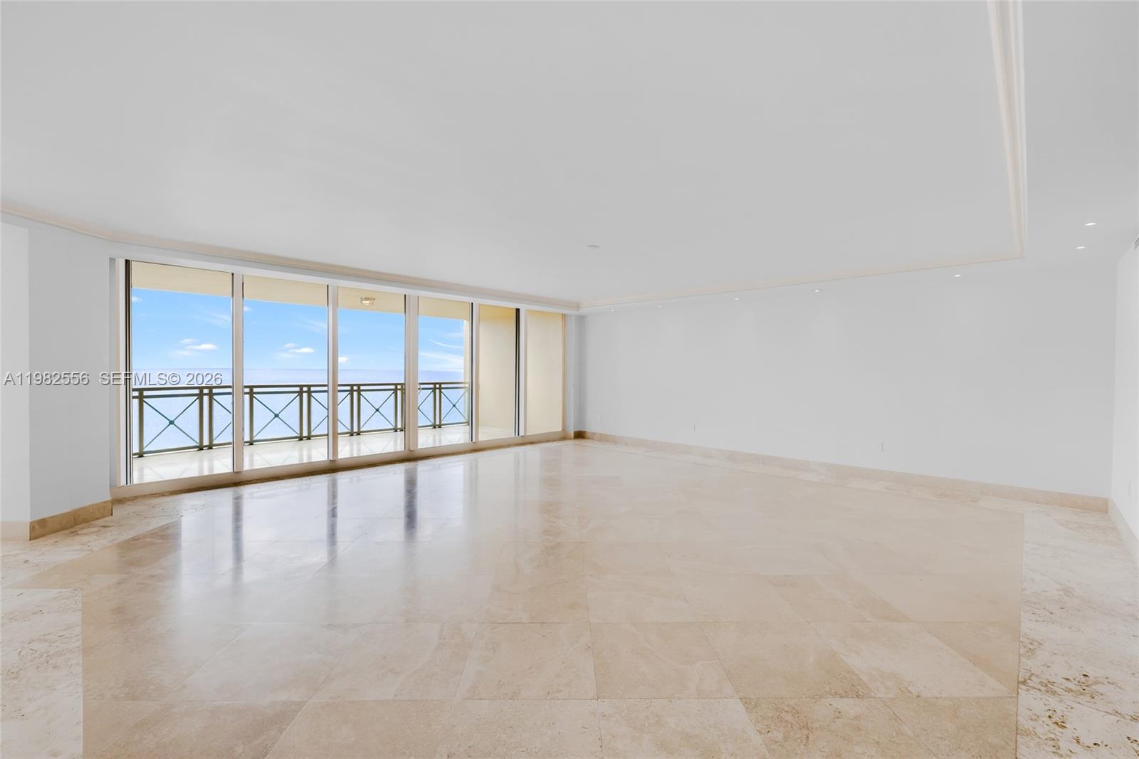 430 Grand Bay Drive, Unit 902 Key Biscayne, FL 33149 - Photo 3 of 87 a view of an empty room with a window and wooden floor