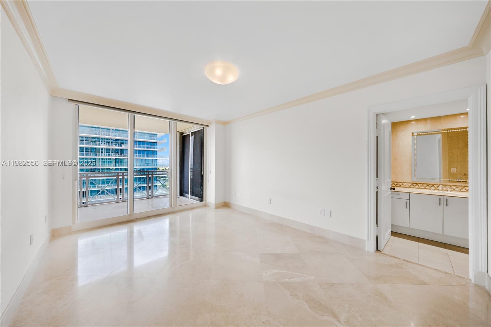 430 Grand Bay Drive, Unit 902 Key Biscayne, FL 33149 - Photo 34 of 87 a view of an empty room with a window and a kitchen