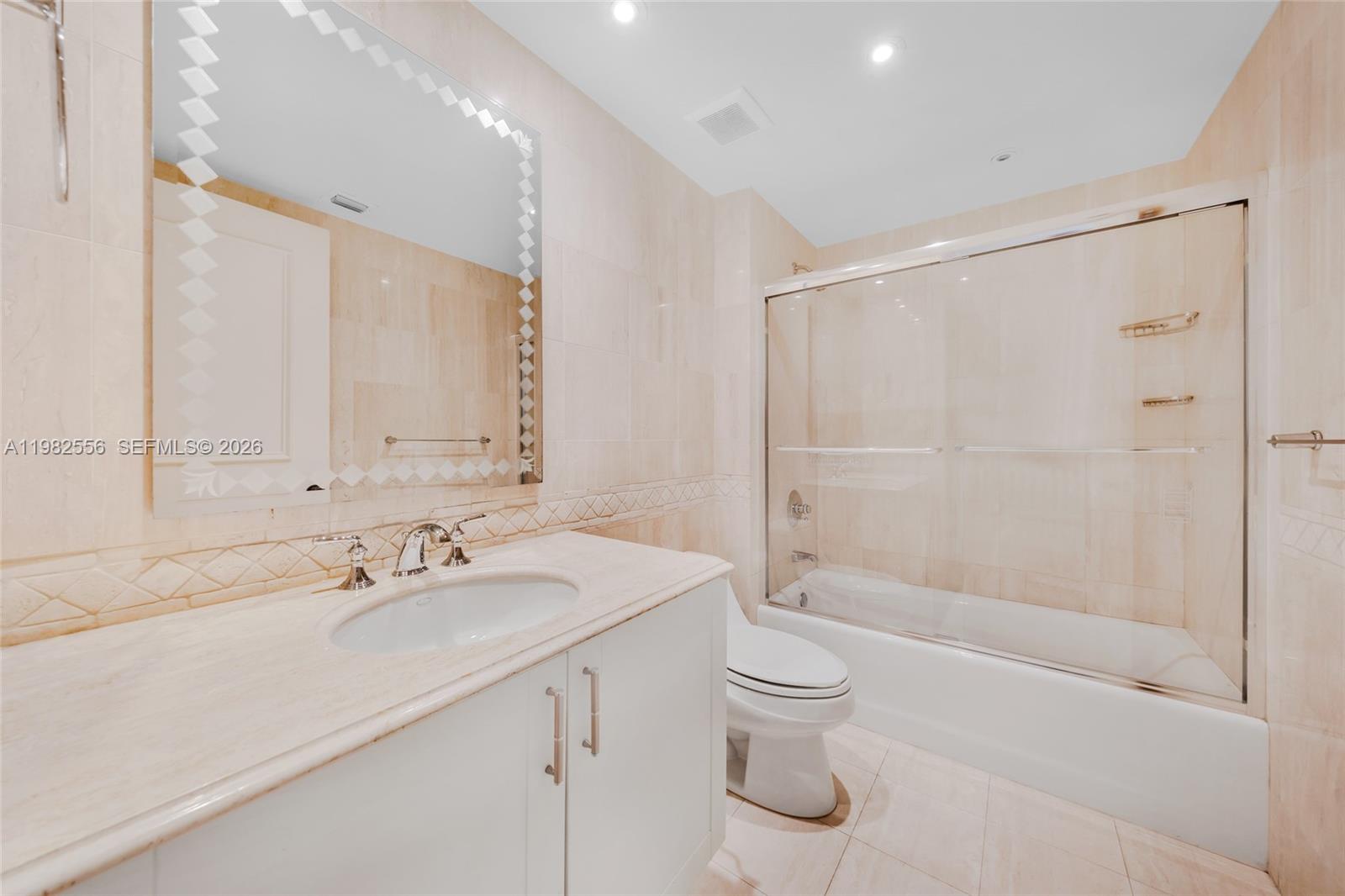 430 Grand Bay Drive, Unit 902 Key Biscayne, FL 33149 - Photo 38 of 87 a bathroom with a sink a toilet and shower