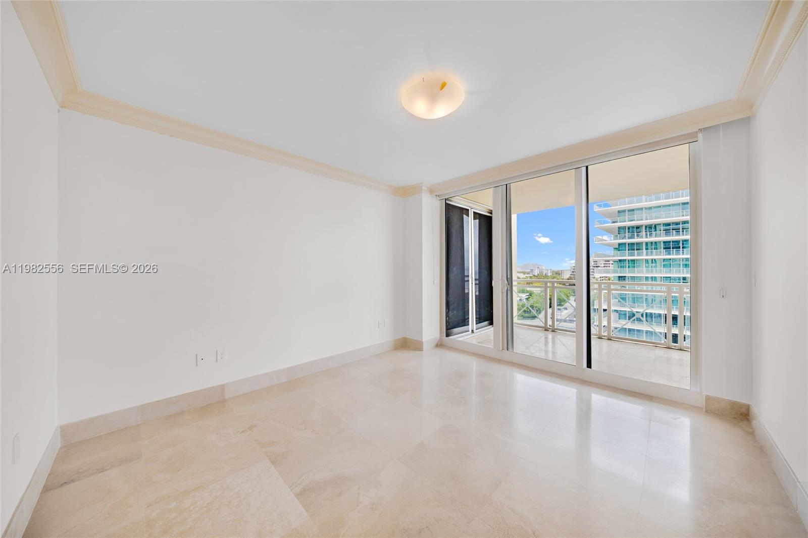 430 Grand Bay Drive, Unit 902 Key Biscayne, FL 33149 - Photo 40 of 87 a view of an empty room with glass door