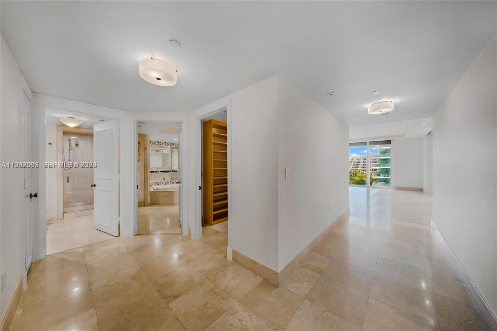 430 Grand Bay Drive, Unit 902 Key Biscayne, FL 33149 - Photo 44 of 87 a view of a hallway with wooden shelves