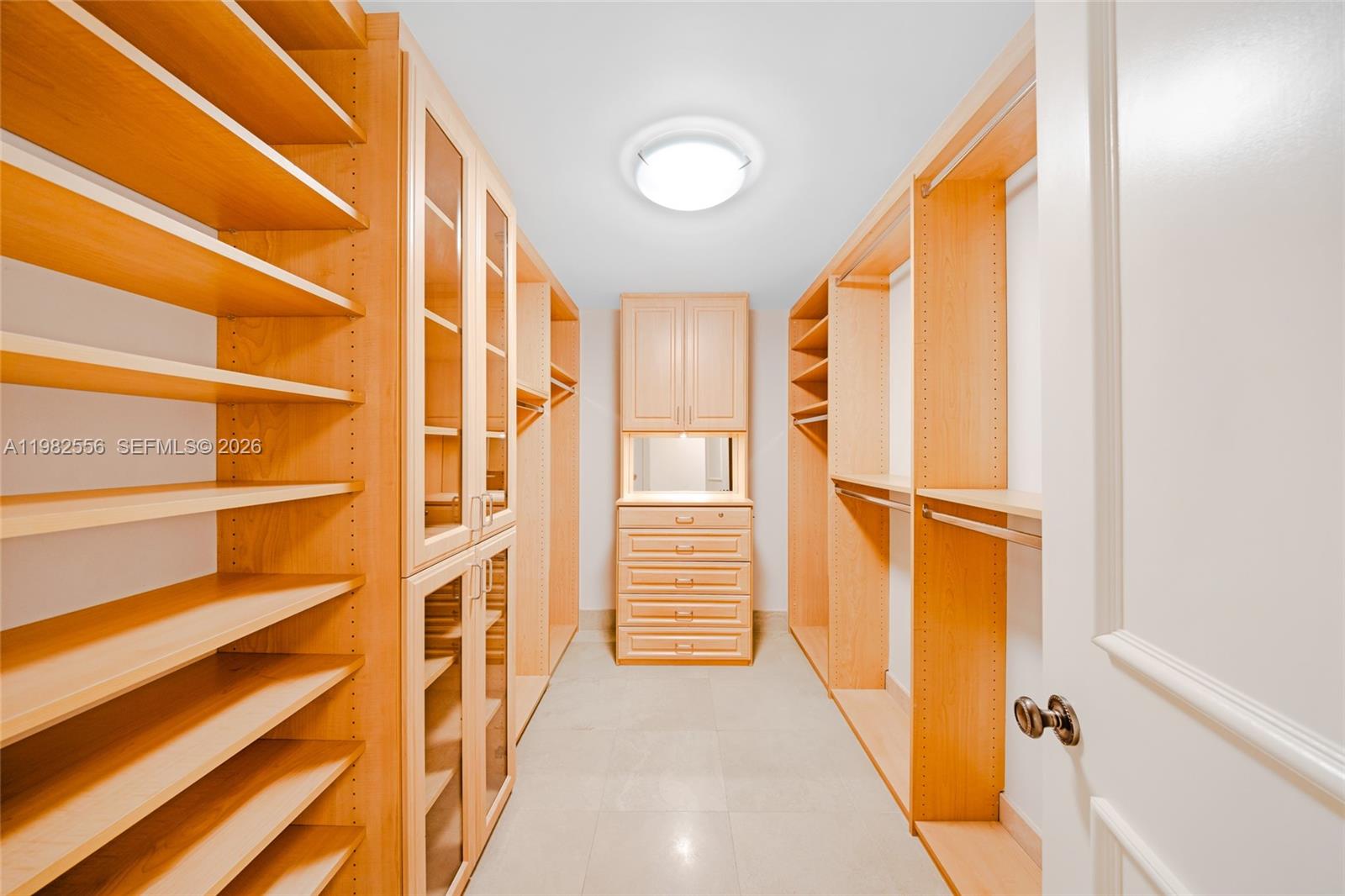 430 Grand Bay Drive, Unit 902 Key Biscayne, FL 33149 - Photo 51 of 87 a view of walk in closet with empty racks