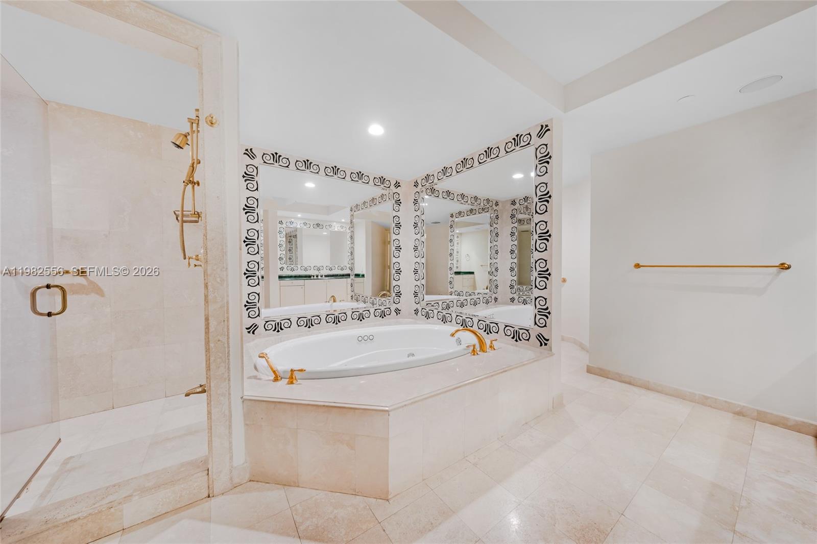 430 Grand Bay Drive, Unit 902 Key Biscayne, FL 33149 - Photo 55 of 87 a bathroom with a tub sink mirror and shower