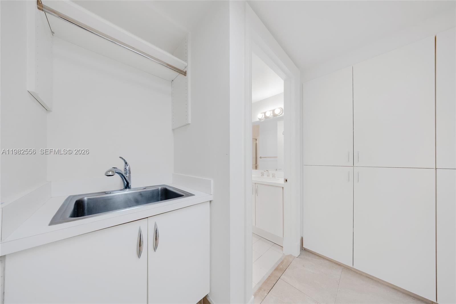 430 Grand Bay Drive, Unit 902 Key Biscayne, FL 33149 - Photo 59 of 87 a bathroom with a sink and mirror