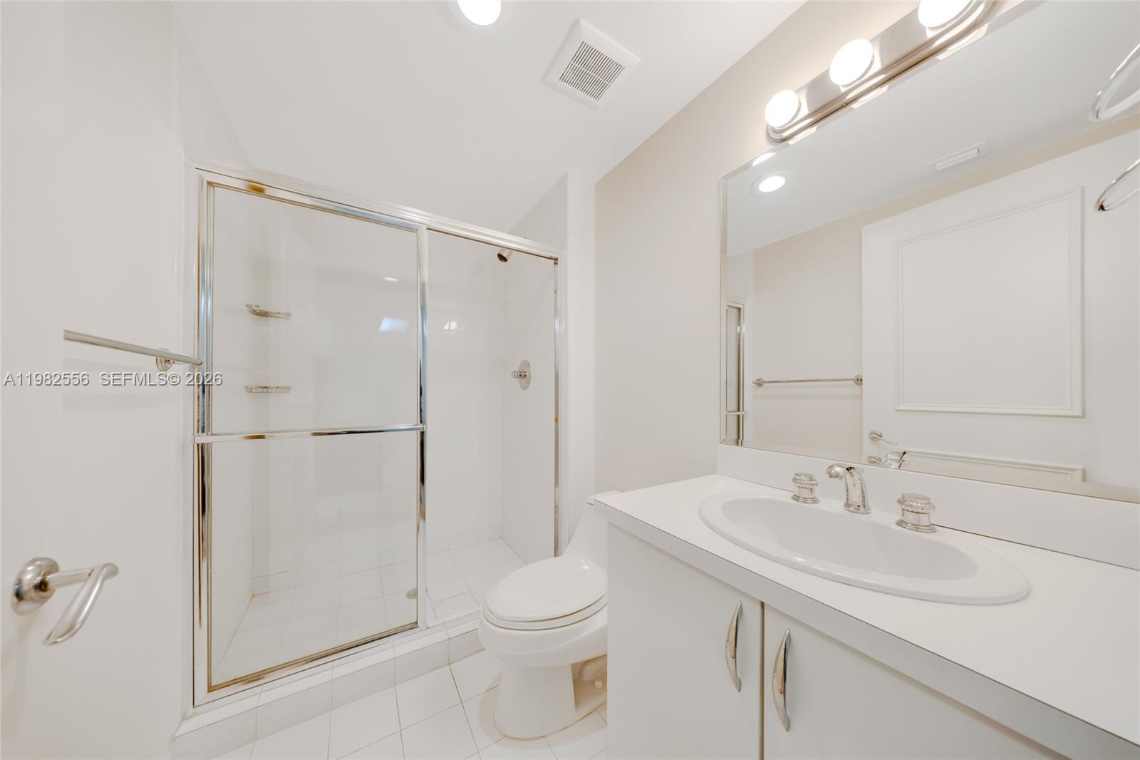 430 Grand Bay Drive, Unit 902 Key Biscayne, FL 33149 - Photo 61 of 87 a bathroom with a sink toilet and shower