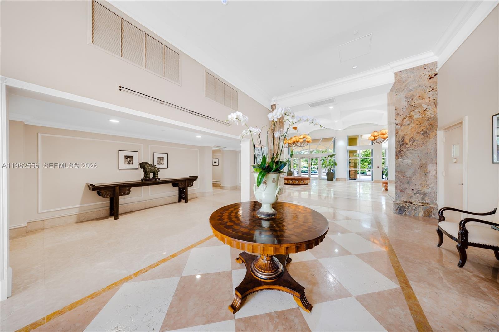 430 Grand Bay Drive, Unit 902 Key Biscayne, FL 33149 - Photo 69 of 87 a living room with furniture and a table