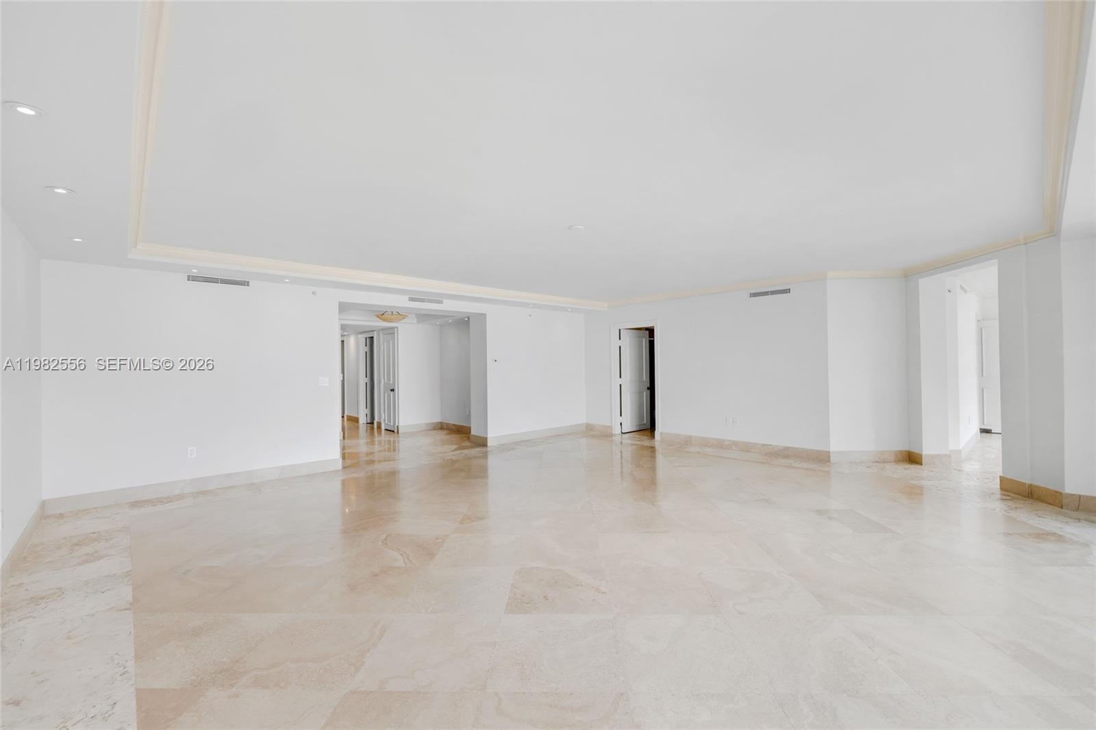 430 Grand Bay Drive, Unit 902 Key Biscayne, FL 33149 - Photo 7 of 87 a view of an empty room with wooden floor and closet