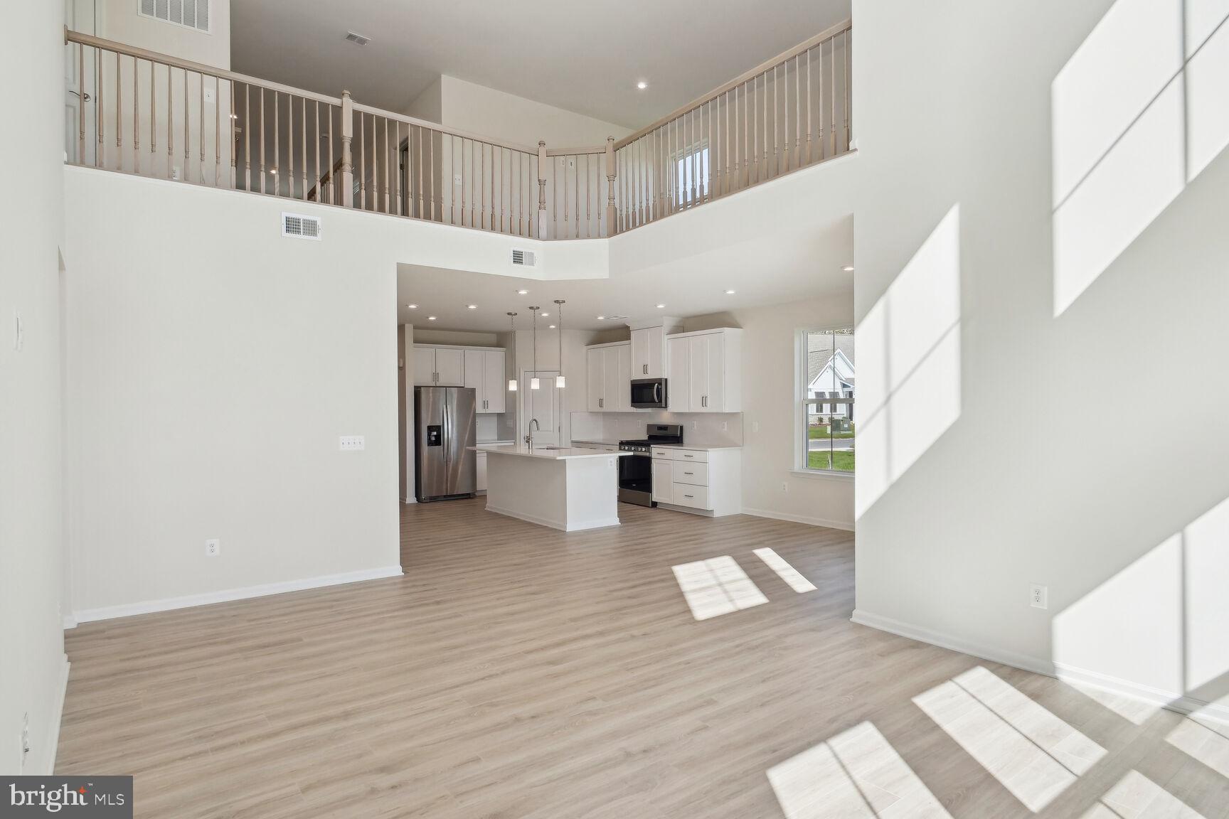 25017 Cypress Court Lewes, DE 19958 - Photo 12 of 14 a view of kitchen with furniture and refrigerator