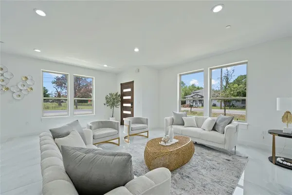 a living room with furniture and a large window