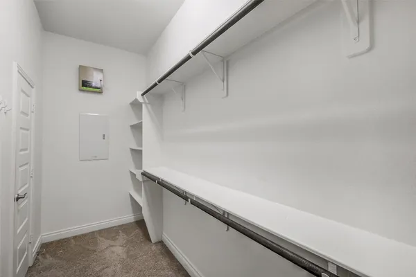 a view of an empty walk in closet