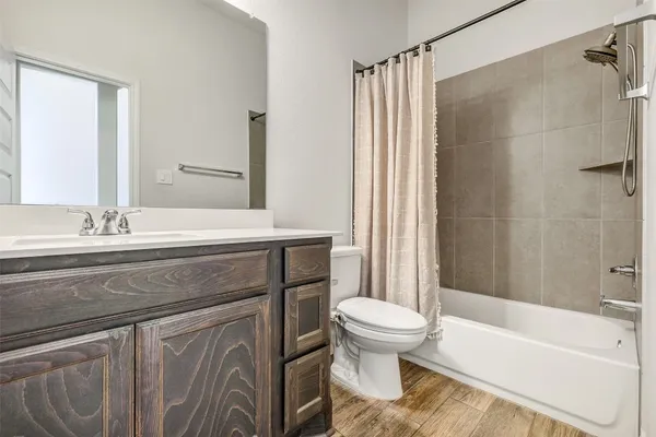 a bathroom with a sink a toilet and a bathtub