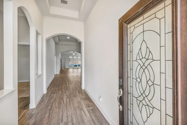 a view of a entryway with wooden floor
