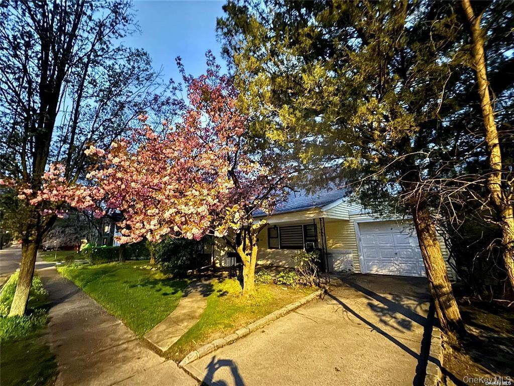 107 Baker Hill Road Great Neck, NY 11023 - Photo 21 of 29 a view of house with a yard