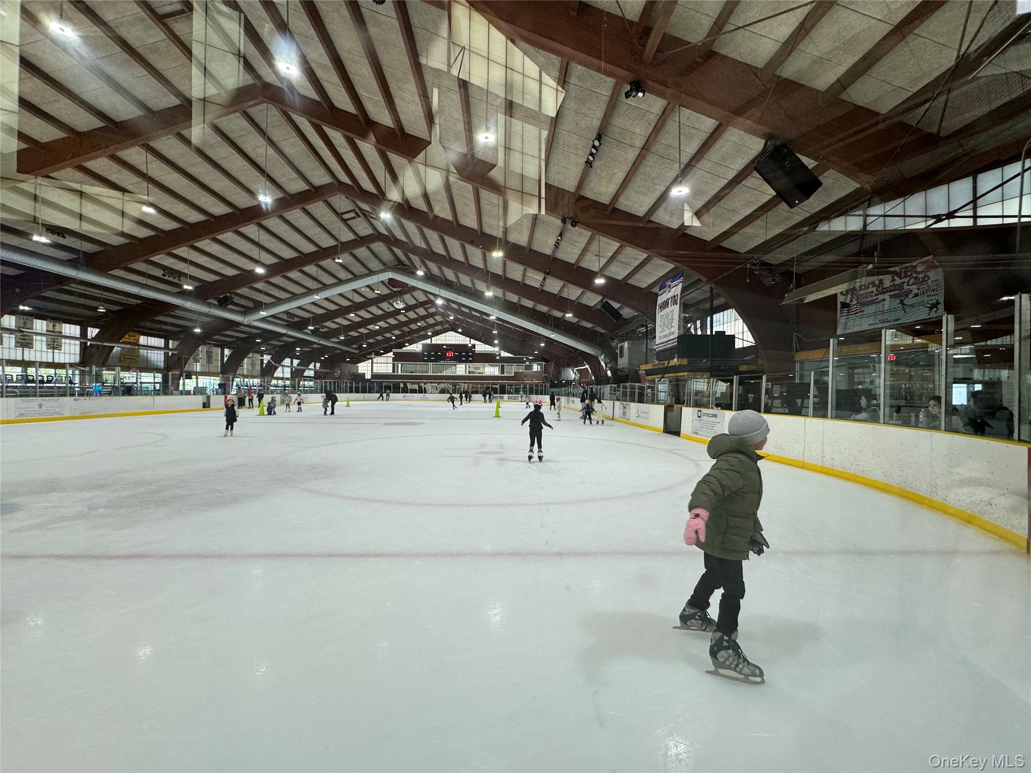 107 Baker Hill Road Great Neck, NY 11023 - Photo 25 of 29 a view of a gym with wooden roof