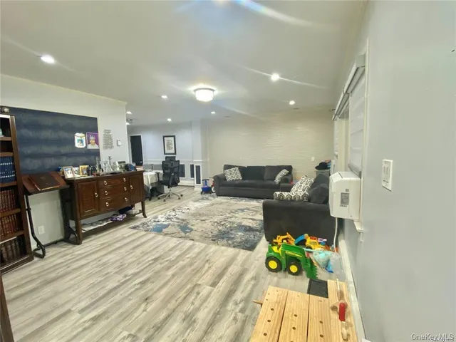 a view of an empty room and wooden floor