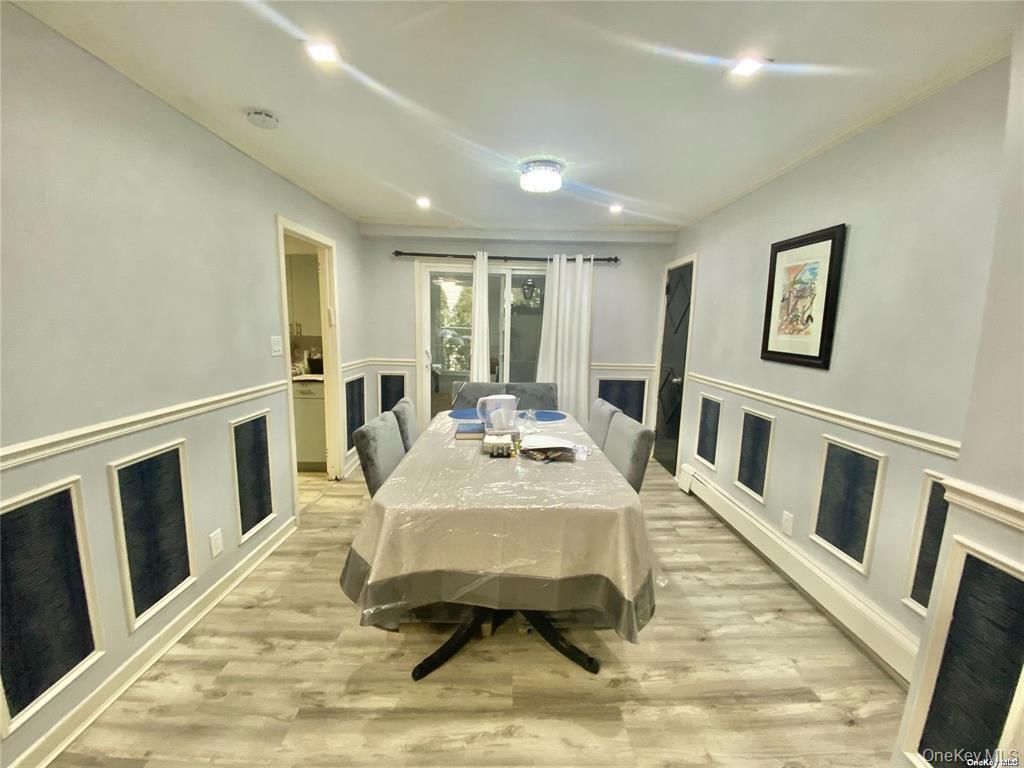 107 Baker Hill Road Great Neck, NY 11023 - Photo 5 of 29 a living room with furniture and a table