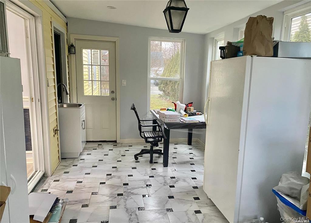 107 Baker Hill Road Great Neck, NY 11023 - Photo 6 of 29 a dining room with furniture and window