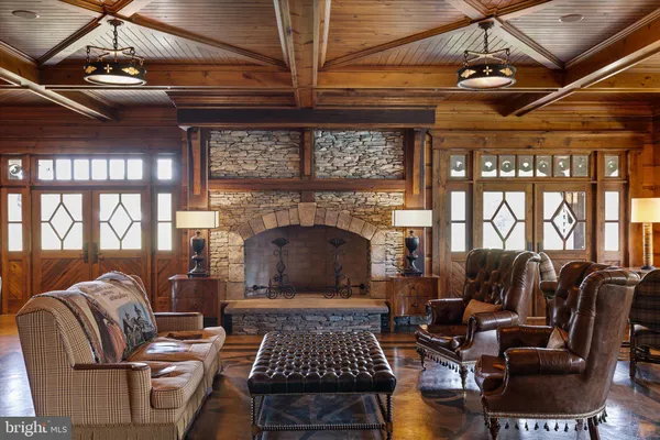 a view of a room with wooden floors and lots of racks
