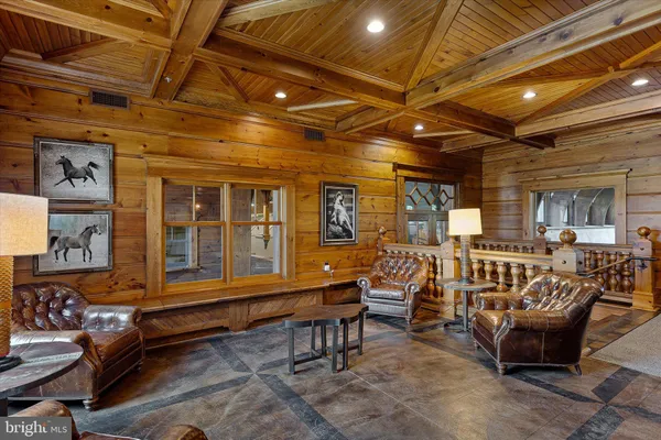 a dining room with furniture window and wooden floor