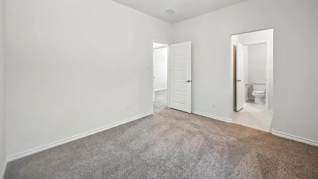 an empty room with closet area