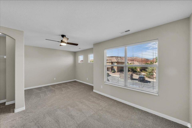 3155 South Hidden Dr Street, Unit 248 St. George, UT 84790 - Photo 10 of 24 Spacious room featuring neutral carpeting and light gray walls