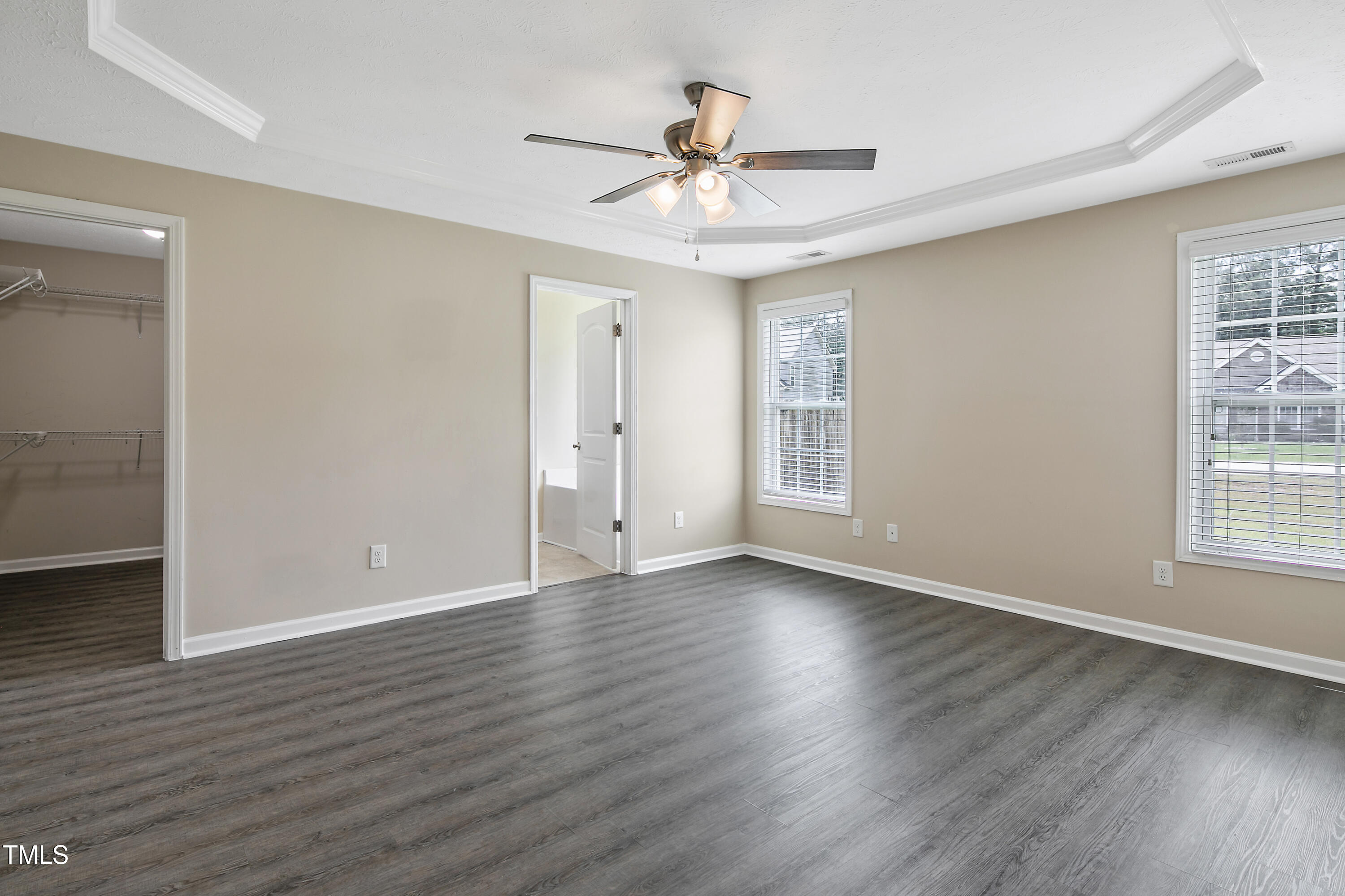 949 Raspberry Road Stedman, NC 28391 - Photo 14 of 31 a view of an empty room with wooden floor and a window