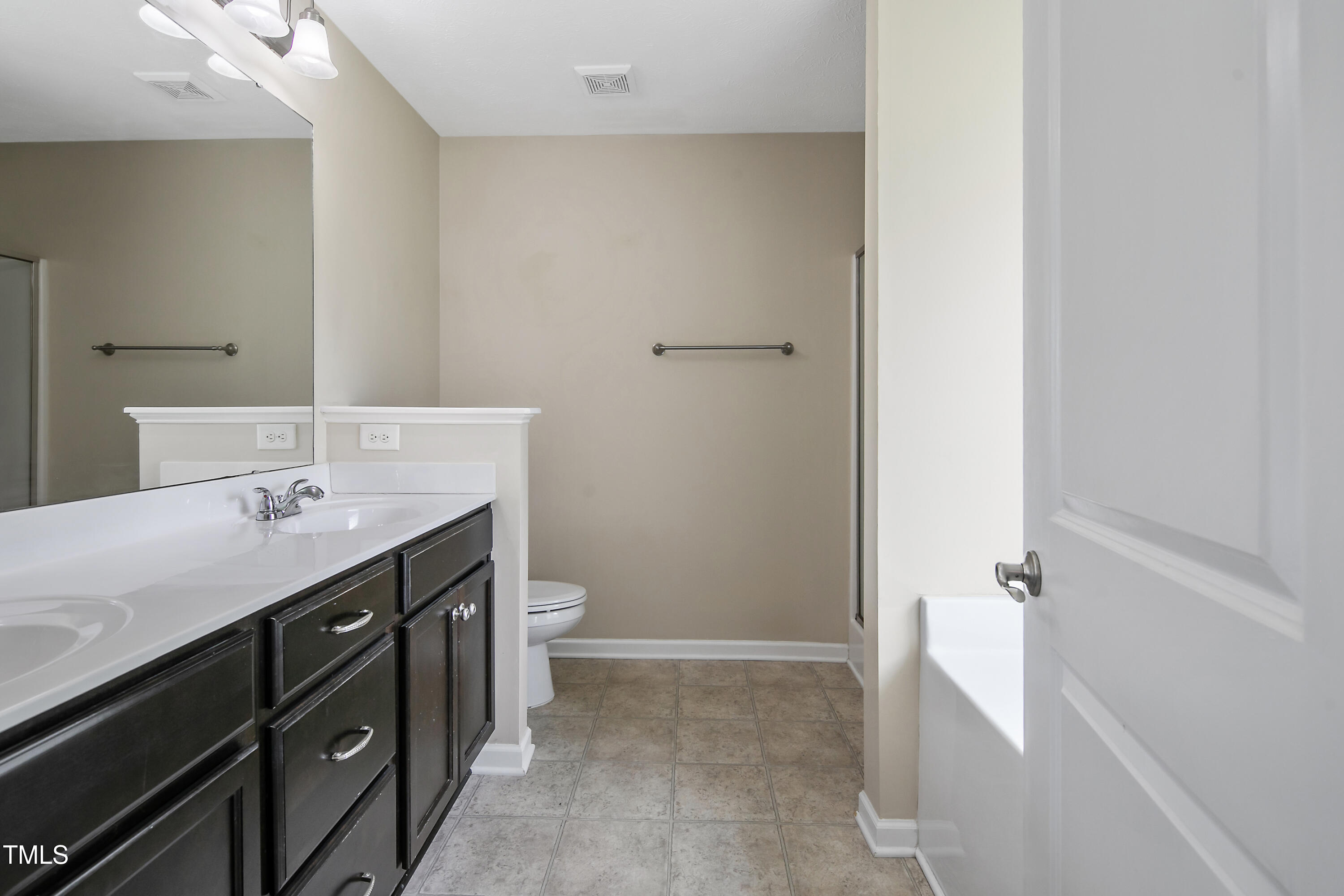 949 Raspberry Road Stedman, NC 28391 - Photo 16 of 31 a bathroom with a sink a toilet and shower