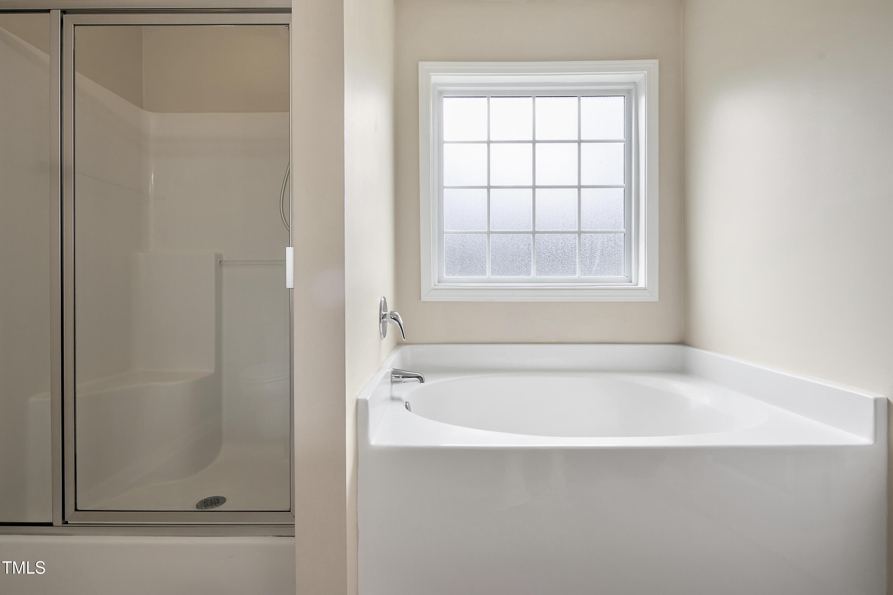 949 Raspberry Road Stedman, NC 28391 - Photo 17 of 31 a white bath tub sitting next to a window