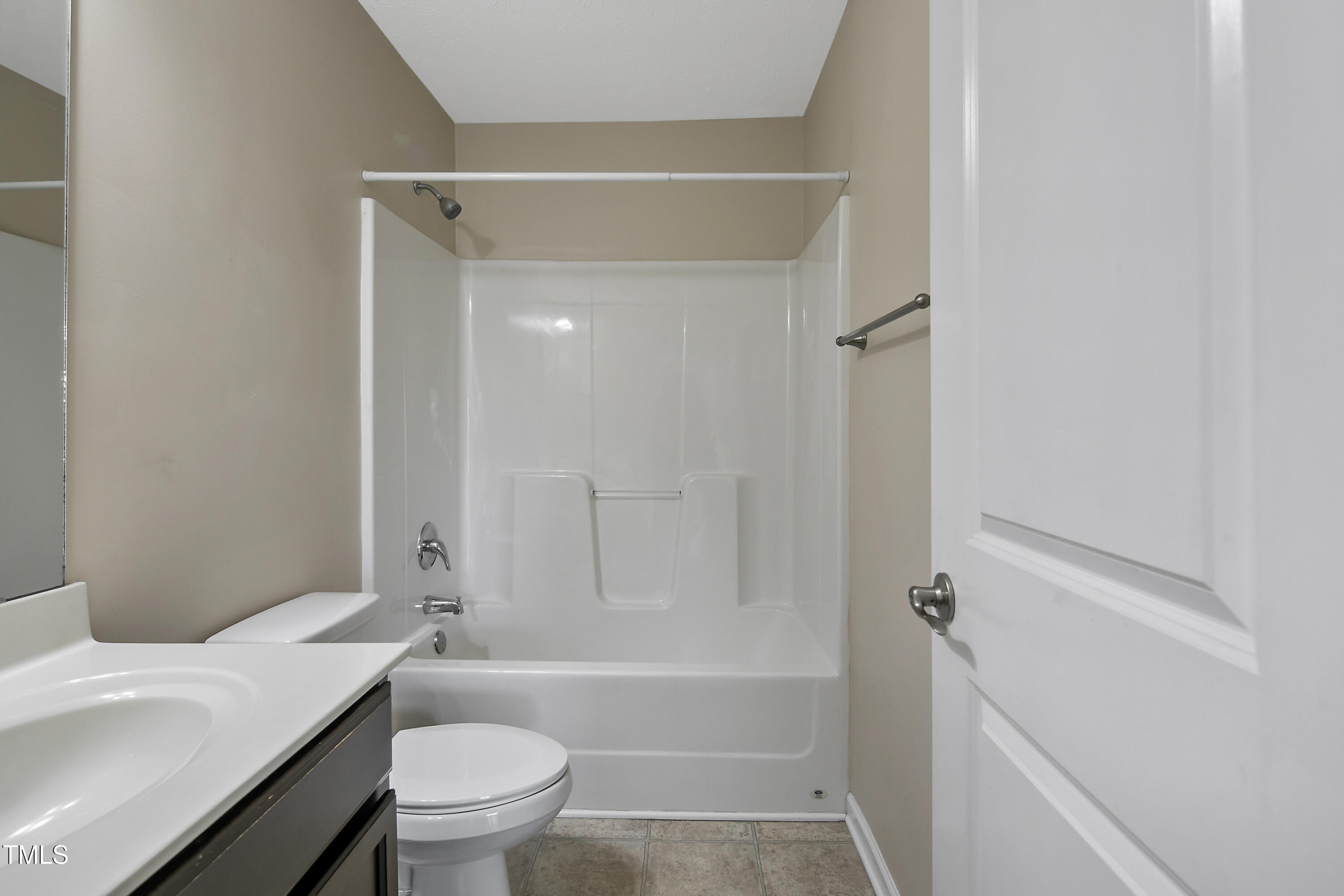 949 Raspberry Road Stedman, NC 28391 - Photo 20 of 31 a bathroom with a granite countertop toilet sink and shower