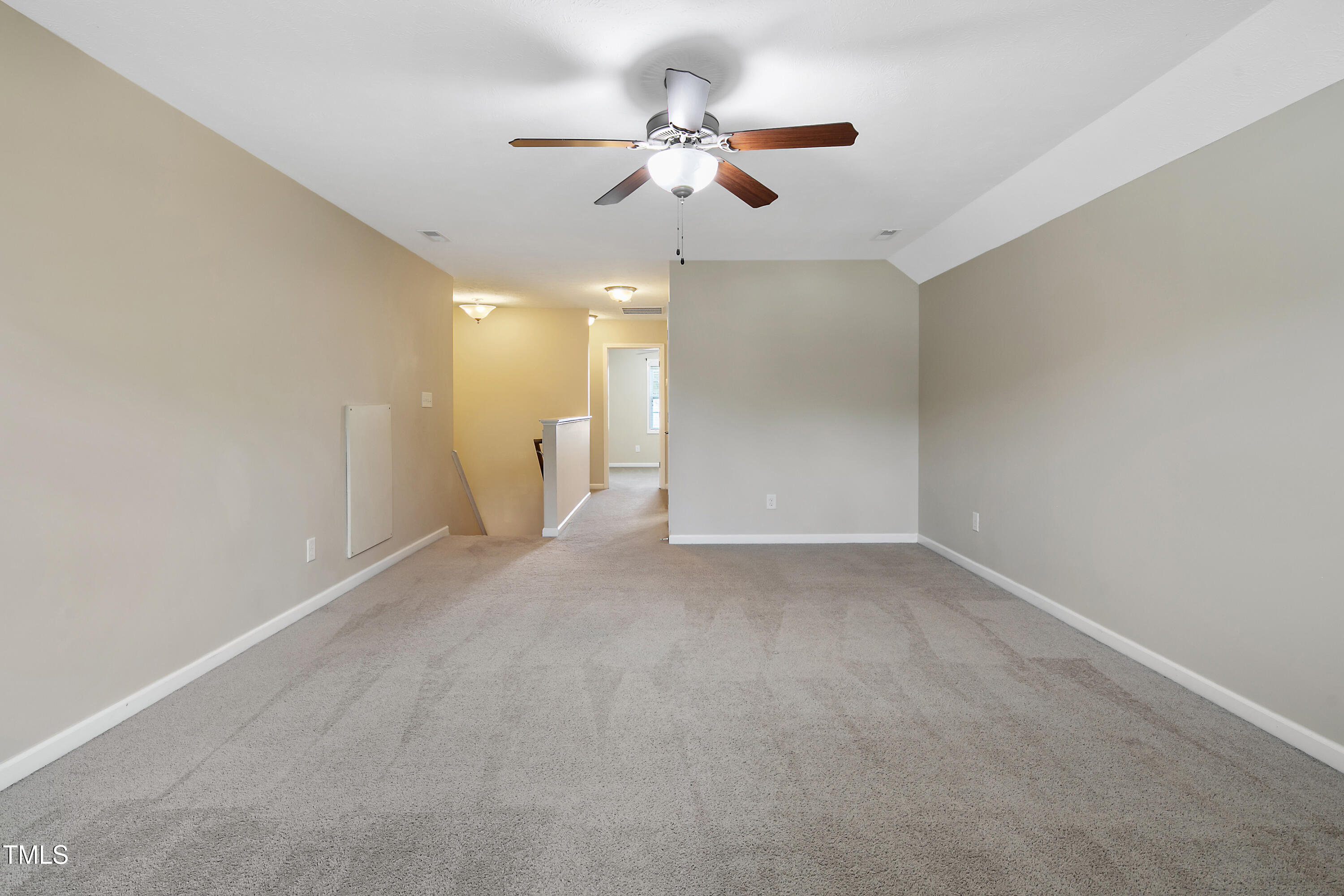 949 Raspberry Road Stedman, NC 28391 - Photo 23 of 31 a view of an empty room with a ceiling fan