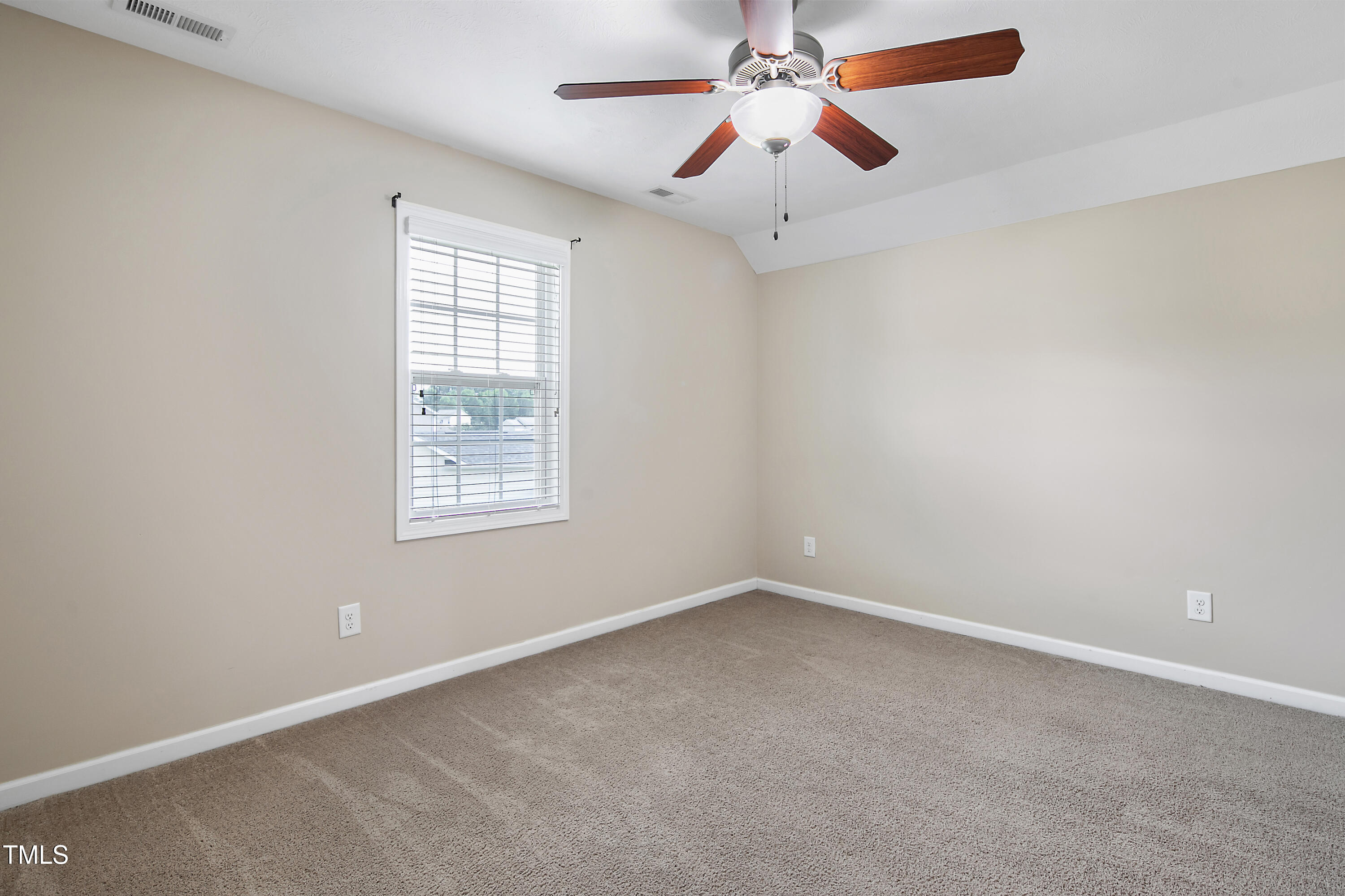 949 Raspberry Road Stedman, NC 28391 - Photo 25 of 31 an empty room with a window and a fan