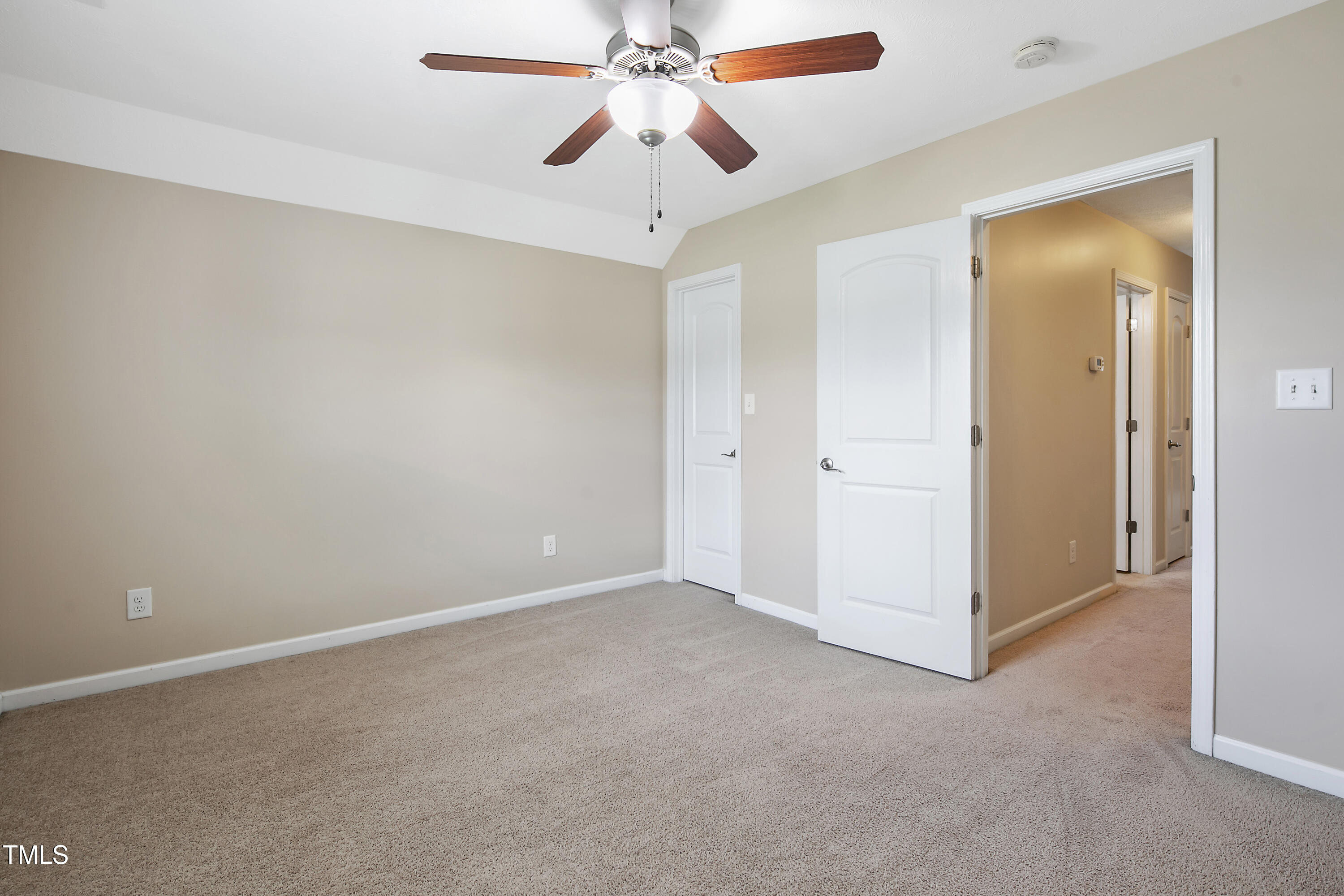949 Raspberry Road Stedman, NC 28391 - Photo 26 of 31 an empty room with chandelier fan