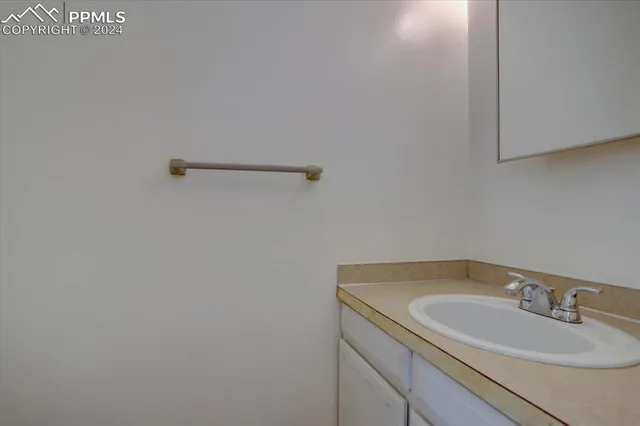 a bathroom with a sink and vanity