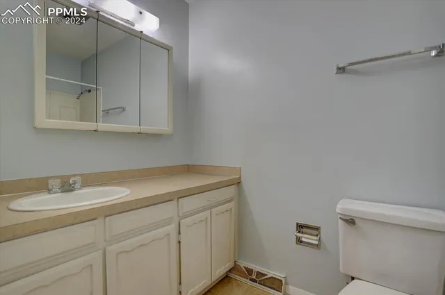 a bathroom with a sink and vanity