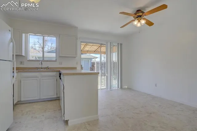 a kitchen with a stove and a sink