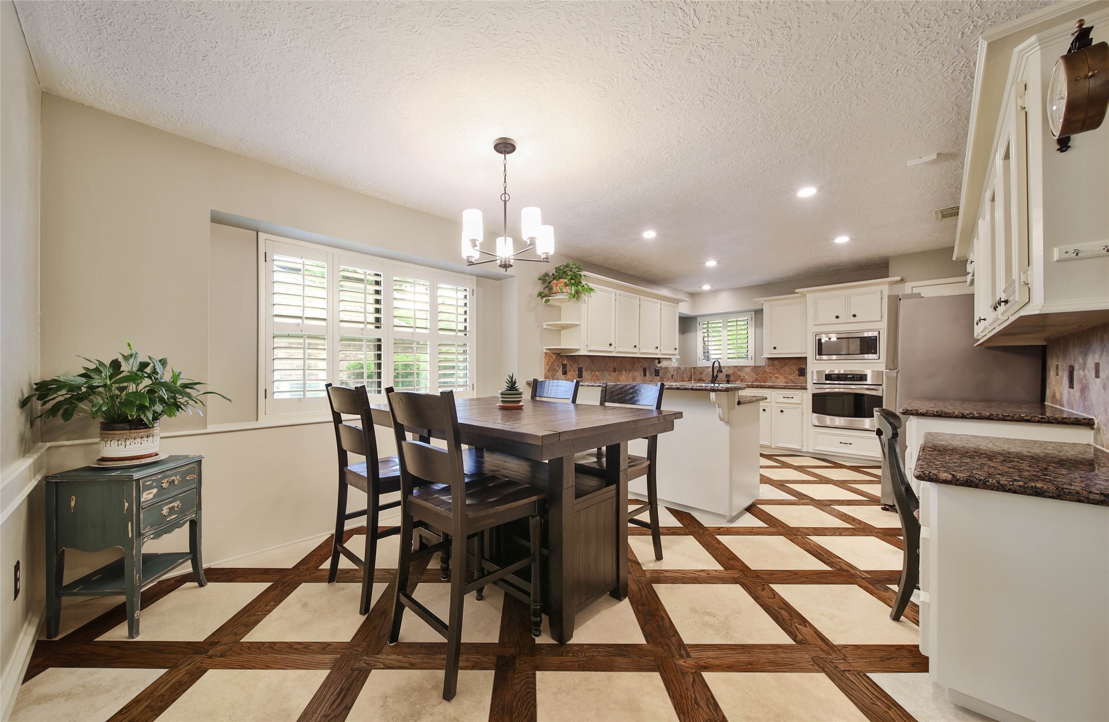 17007 Windrow Drive Spring, TX 77379 - Photo 11 of 46 a view of a dining room with furniture and a floor to ceiling window