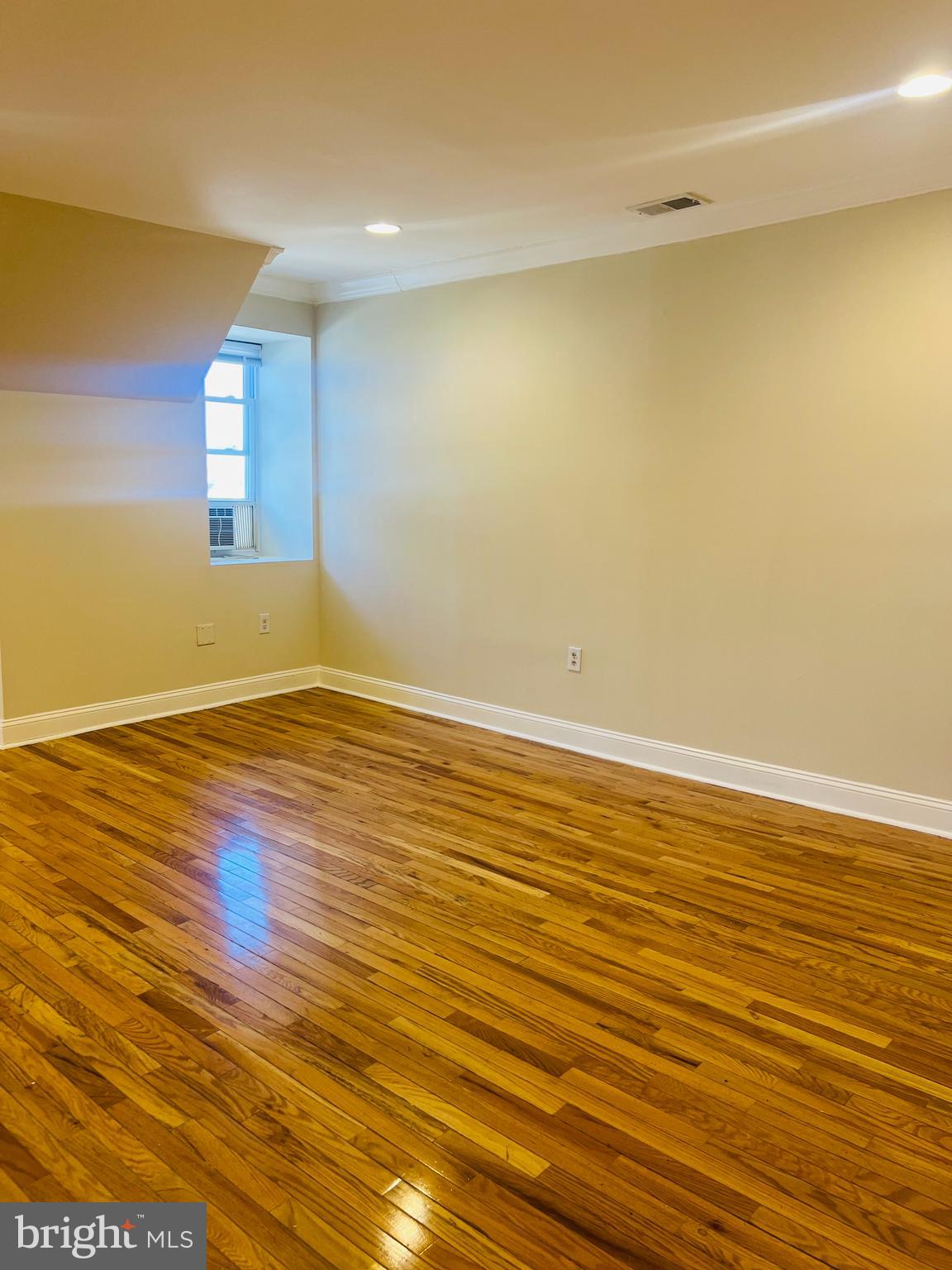 817 North 63rd Street, Unit 3 Philadelphia, PA 19151 - Photo 6 of 10 wooden floor in an empty room