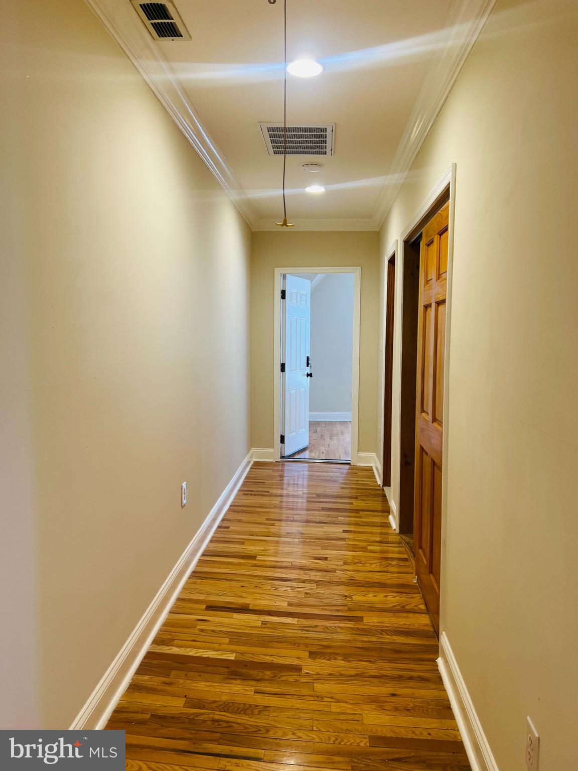 817 North 63rd Street, Unit 3 Philadelphia, PA 19151 - Photo 8 of 10 a view of a room with wooden floor and staircase
