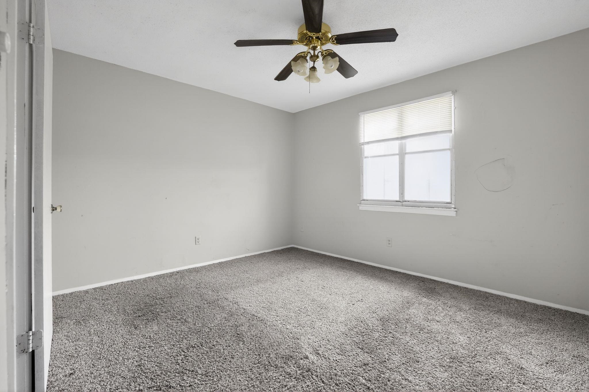 3420 Forrester Road Memphis, TN 38109 - Photo 13 of 30 Spare room with carpet flooring and ceiling fan