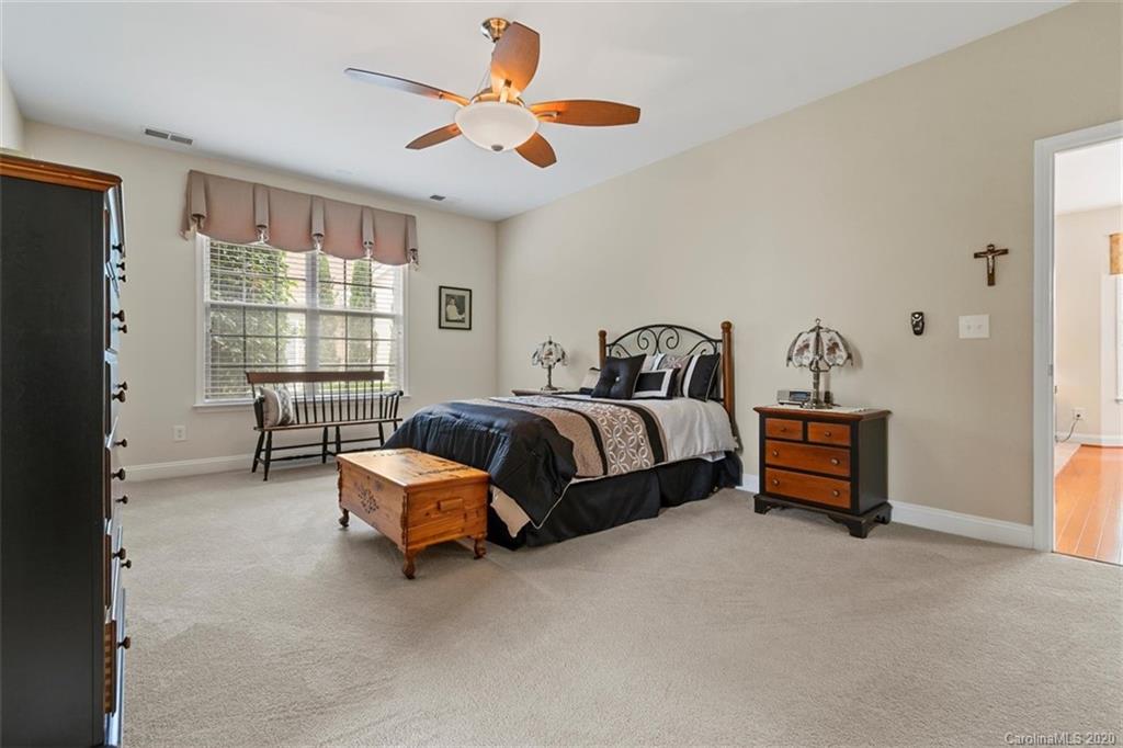 2006 Citron Avenue Fort Mill, SC 29708 - Photo 14 of 35 a bedroom with a bed and a chandelier